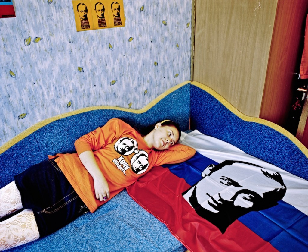 Alina, "For me Putin is the president who has led our country out of the crisis and raised us to a new level. When I joined the fan club I wanted to be active. I have a Russian flag with Putin hanging on the wall above my desk in my room. Every day I look for publications in the press, in the internet, I learn from newspapers about what is going on in his political and personal life. I have a poster with his portrait hanging near my bed. I also own a few t-shirts with Putin's portrait, as well as postcards and stickers. I consider myself a patriot."