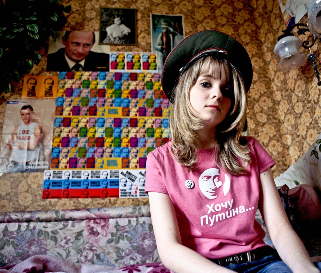 Yulia Minazhetdinova, Russian State Social University. When I entered unviversity I met Igor and he invited me to the events, he said it was interesting and every event was different. I really like Vladimir Vladimirovich, he comes across as nice. I'm grateful to him that he ended the war in Chechnya, that's the most important thing. We paid the largest part of the external debt. He raised pensions and social allowances. The city became better and it's his achievement. I have many things with his image: pins, several t-shirts, a screensaver. My fascination with VV helps me understand politics better, for example, after the fan club's protest at the Georgian embassy I understood what relationship we have with Georgia and why we have a conflict. My parents are against my hobby, they say I don't understand politics but I don't think so. Putin is my hero, he inspires me, adds scence to my actions, I want to aspire to him.